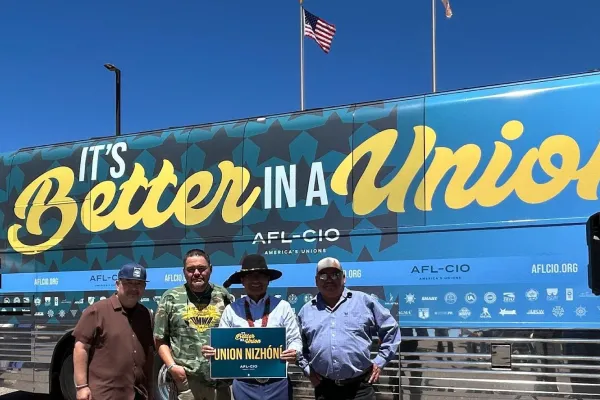 Nal-NiSHii organizers standing outside the Better in a Union bus tour